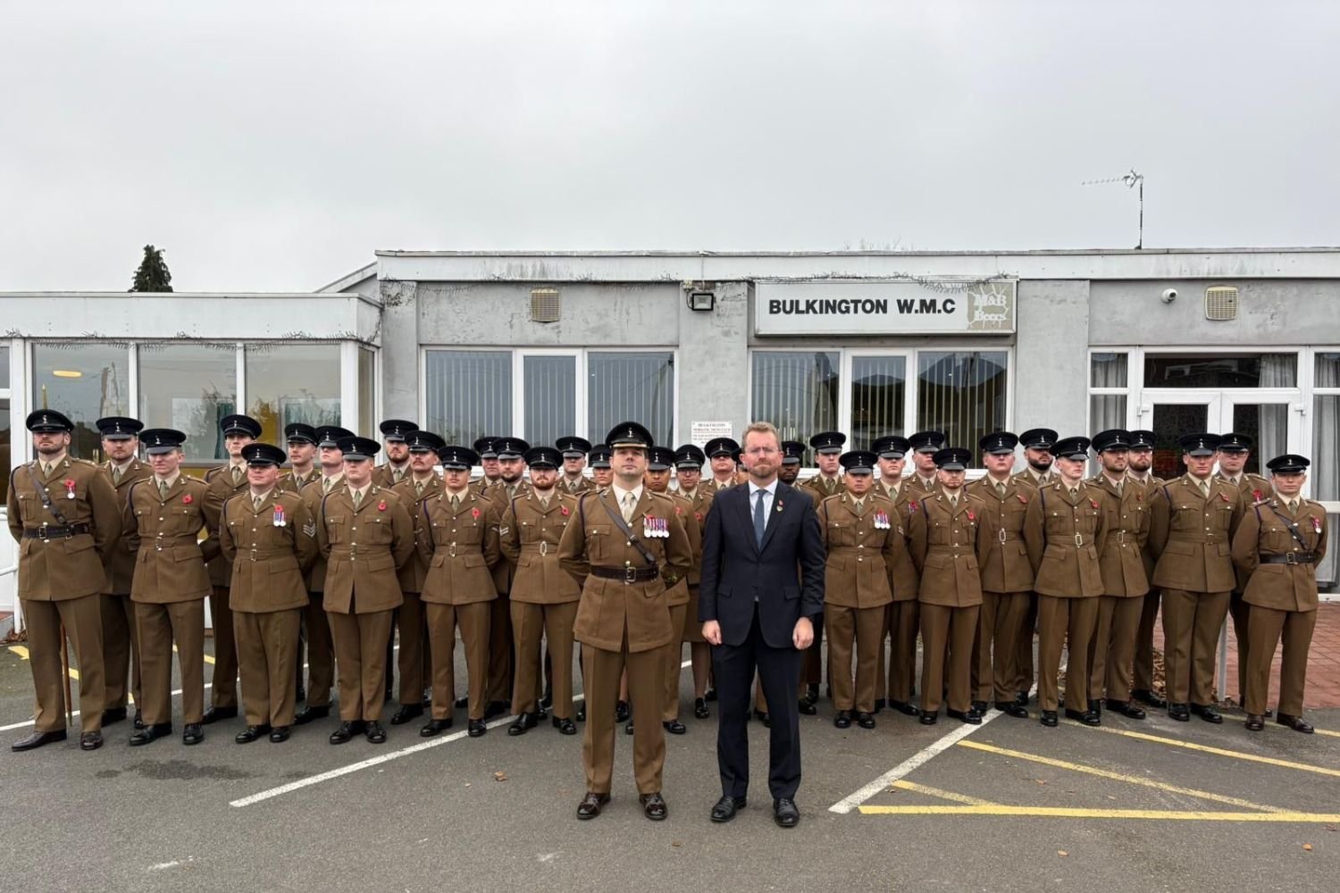 John with army personnel outside Bulkington Working Men's Club on Remembrance Day