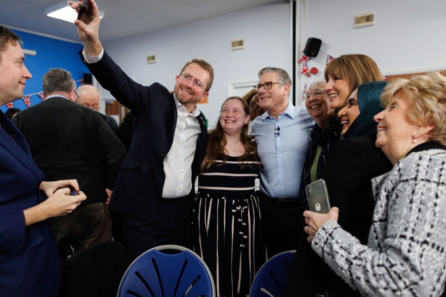 John taking a selfie with the Prime Minister and constituents